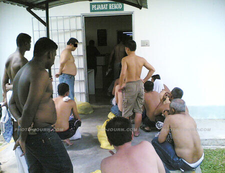 Prisoners wait to be processed at Sungai Buloh prison
