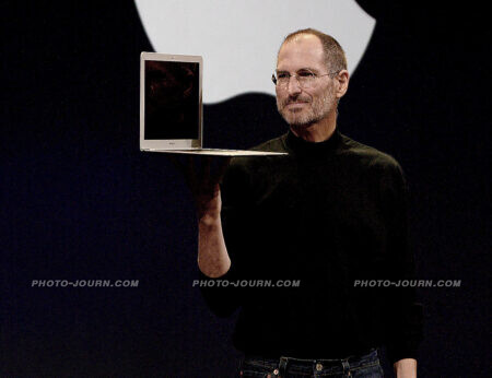 Steve Jobs unveils the Macbook Air.: whistles and applause for breathing