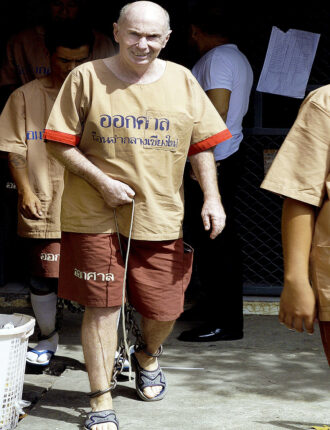 William Douglas attends Chiang Mai court in leg irons July 7