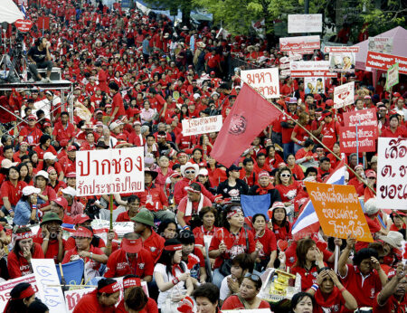 6.26 am April 8 and red-shirt supporters jam the streets around Thailand Government House 