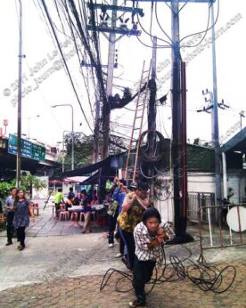 Running new telephone or data cables in Thailand. 