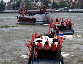 Red-shirt protesters converge on Bangkok by boat to circumvent government road blocks setup to try and prevent the red-shirt rally from taking place
