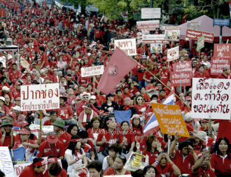 By 7.00am tens of thousands of red-shirt protesters had already gathered in front of Thailand's Government House.