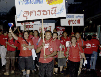 Red-shirt pro-democracy protesters from Udon Thani in Thailand's north arrive at Government House.