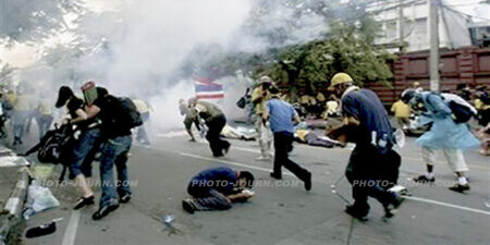 TAT governor, Phornsiri Manoharn thinks scenes such as this of anti-government protesters fleeing teargas in front of Bangkok's Parliament House on Tuesday, Oct. 7, 2008 will not dissuade tourists