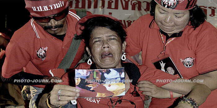 Red shirts defiant as “third hand” blamed for Thailand riots and assassination attempt (gallery)