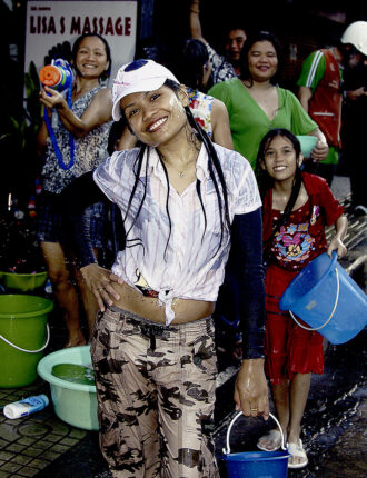 Getting dripping wet is all part of the Songkran festivities in Bangkok when temperatures are ordinarily at the hottest