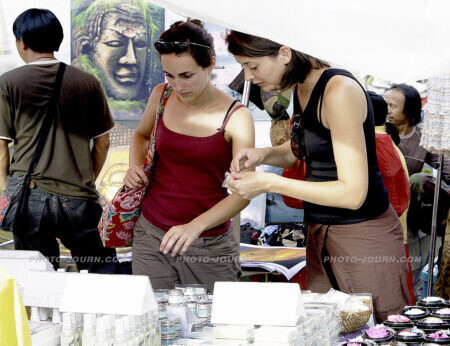 Foreign tourists checking out Thai handicrafts