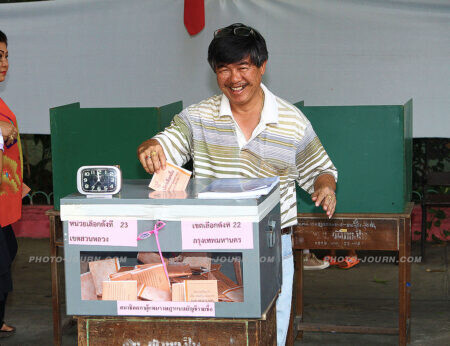 A citizen casts his vote in the 2014 Thailand general election