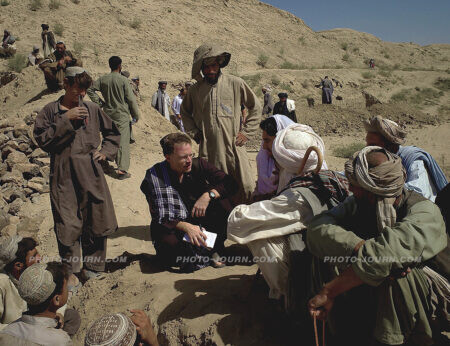 David Rohde, center a New York Times reporter, interviews Afghans in the Helmand region in 2007.