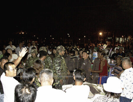Thai police supported by Thai military order red-shirt supporters at Sanam Luang to disperse.